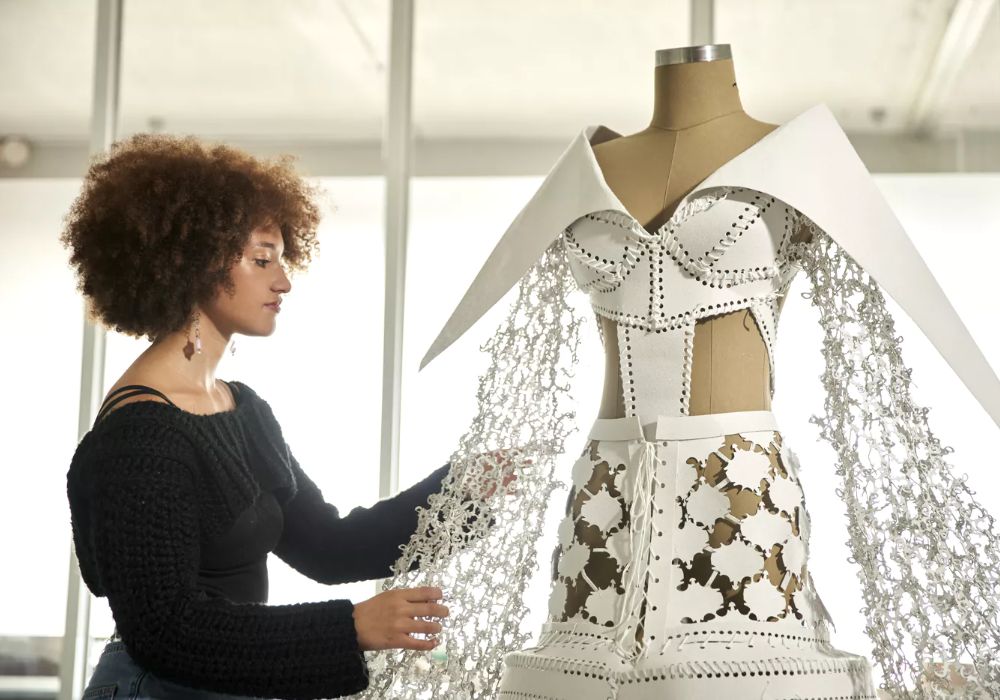 A woman showcasing creativity and unique fashion design.